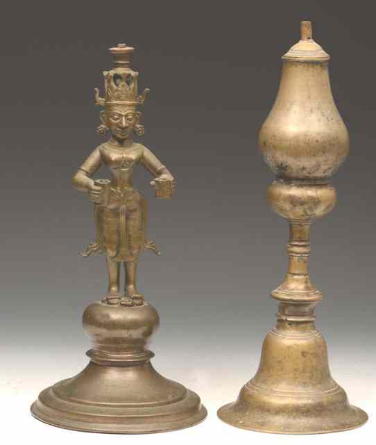 Appraisal: AN INDIAN BRONZE OIL LAMP with Lakshi figure column another