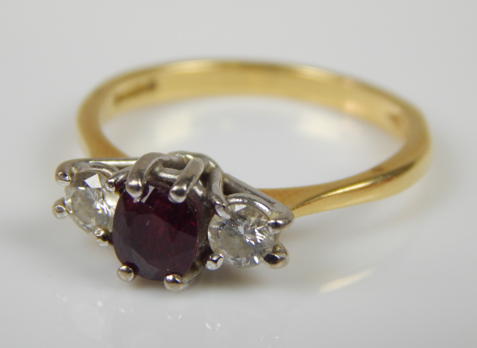 Appraisal: An ct gold ruby and diamond three stone ring with