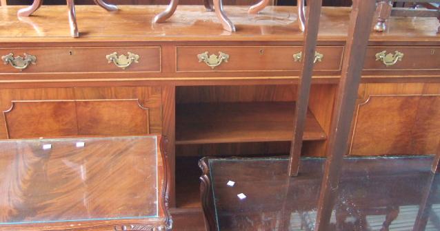 Appraisal: A th century walnut dresser base with three drawers over