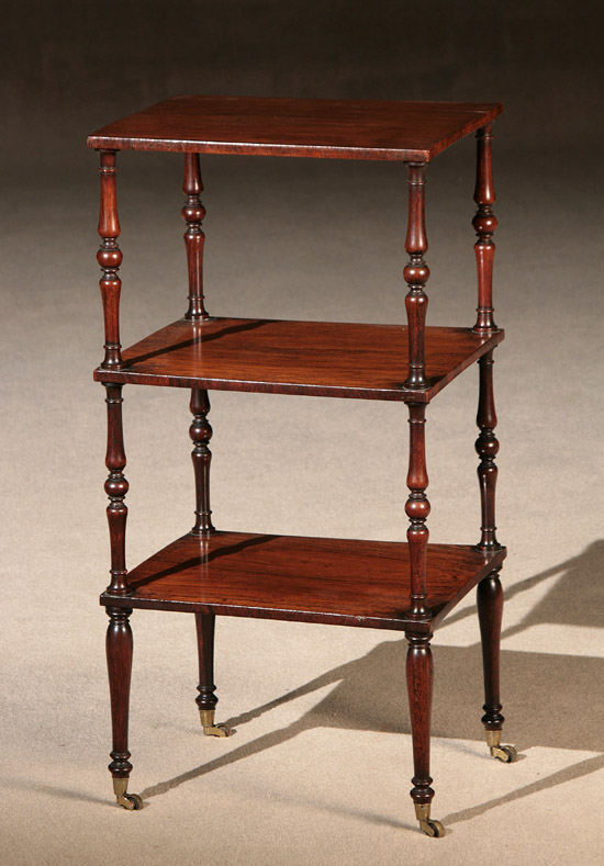 Appraisal: Victorian Rosewood Three-Tier What-Not Mid- th Century Each shelf with