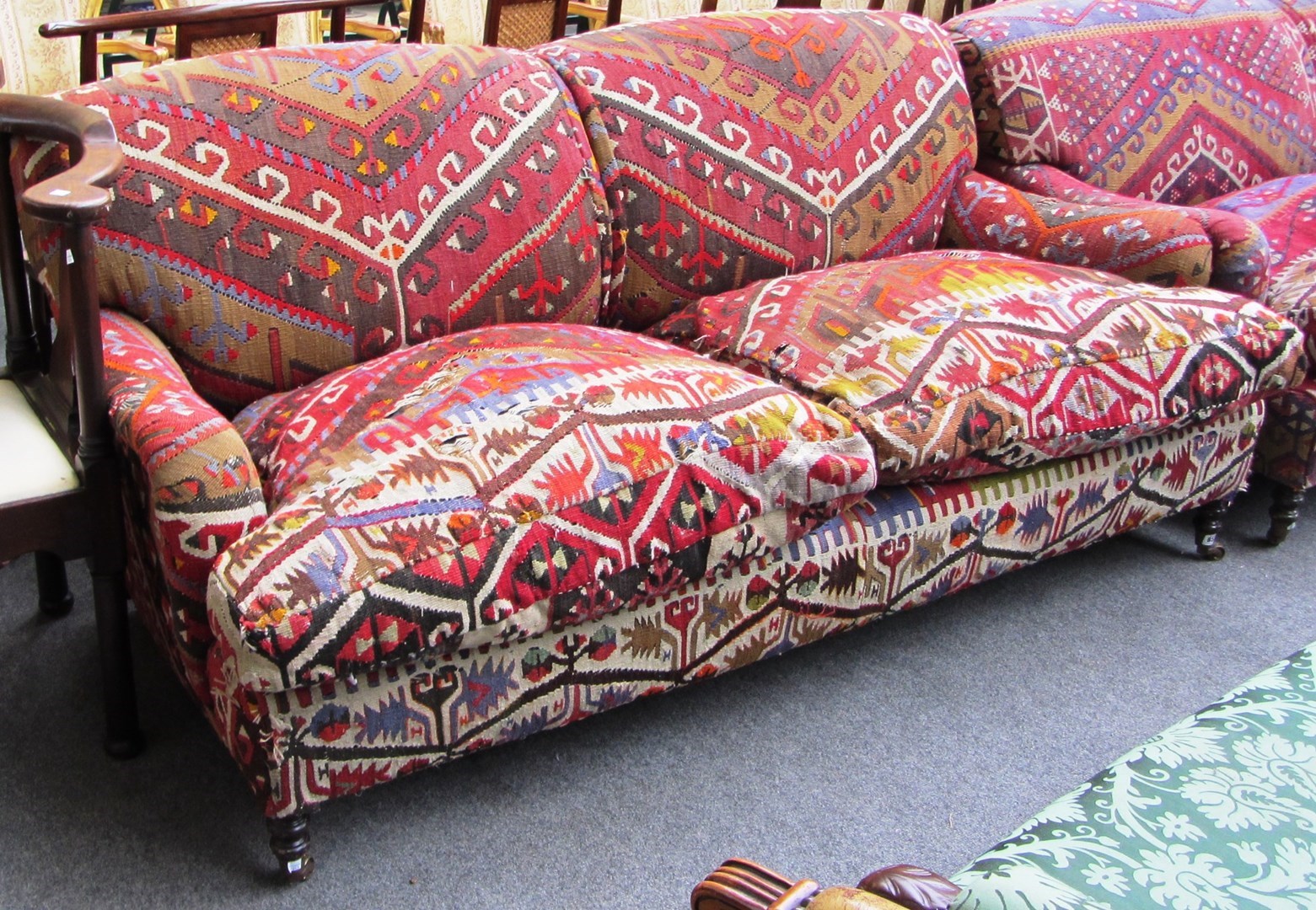 Appraisal: A th century two seater sofa upholstered in flatweave kelim