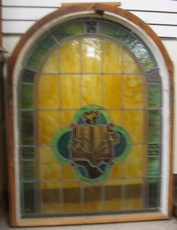 Appraisal: STAINED AND LEADED GLASS WINDOW with rounded top in multi-colors