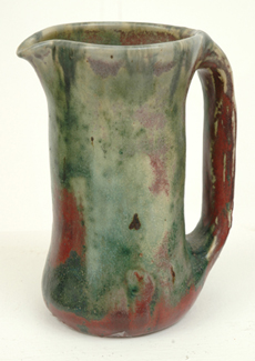 Appraisal: PHILIPPA JAMES Victoria circa Cylindrical flared earthenware jug mottled green