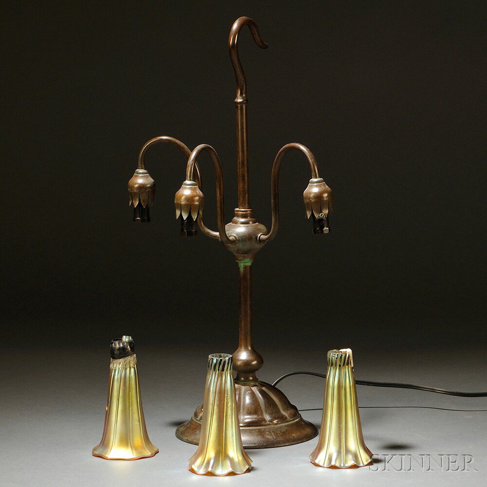 Appraisal: Three-light Lily Lamp Patinated bronze art glass Hook-form top on