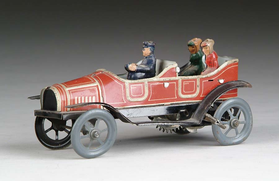 Appraisal: GERMAN TIN WIND UP CAR W LADY PASSENGERS A delightful