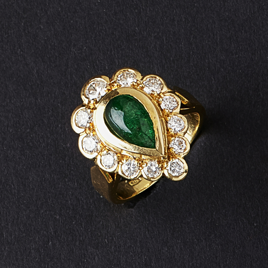 Appraisal: An emerald and diamond set ring collet set with a