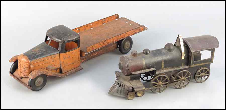 Appraisal: TIN AND IRON TOY TRAIN ENGINE Together with a tin