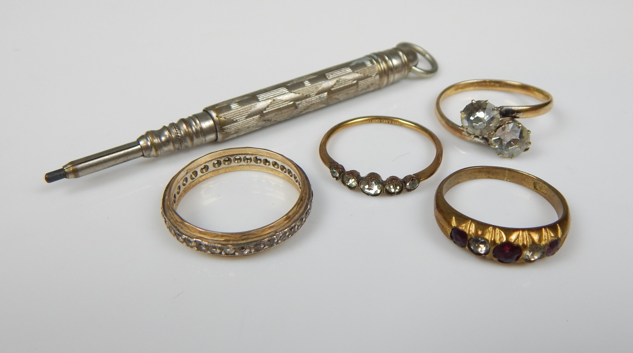 Appraisal: Four dress rings and a silver plated propelling pencil the