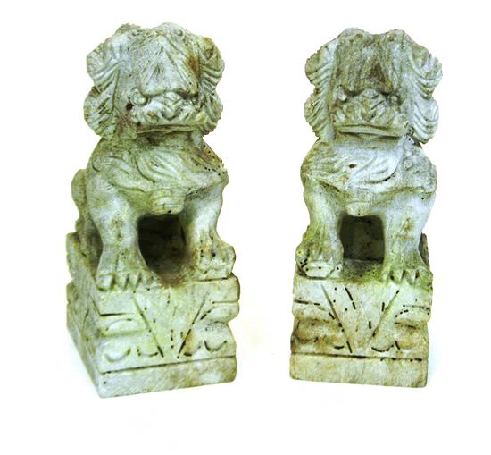 Appraisal: Garden foo lions pair th C white colored stone with