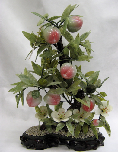 Appraisal: THREE CHINESE HARDSTONE FRUITING JADE TREES having peaches and leaves