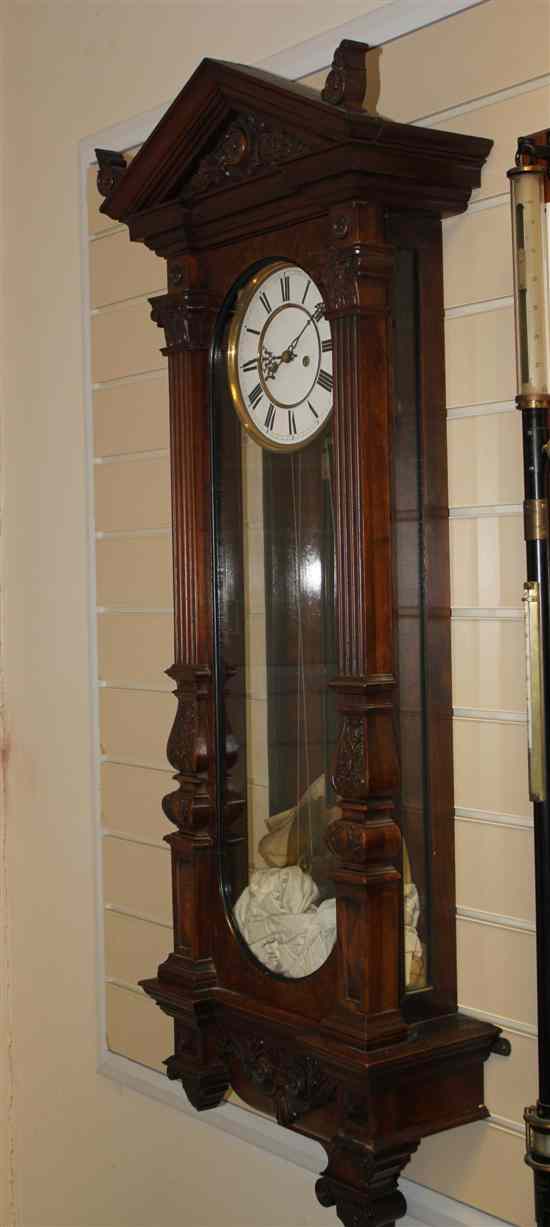 Appraisal: A late th century walnut Vienna wall clock with carved