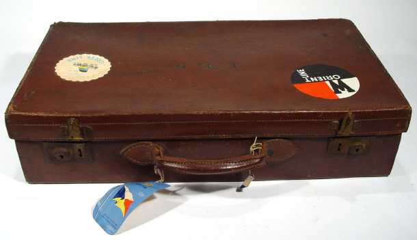 Appraisal: Leather suitcase with applied shipping labels