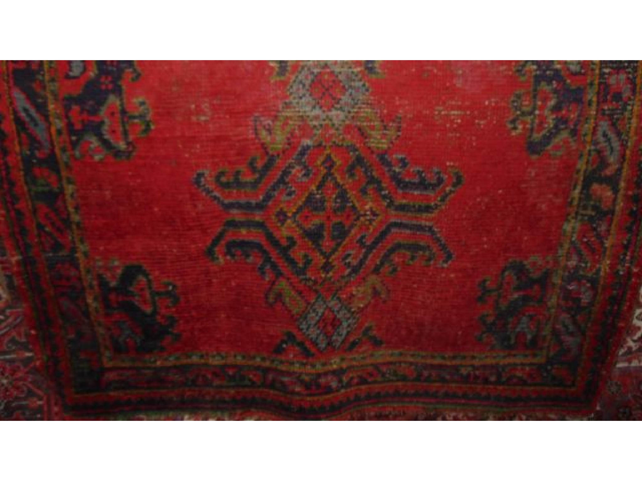 Appraisal: A Turkey wool carpet with red field and alternating geometric