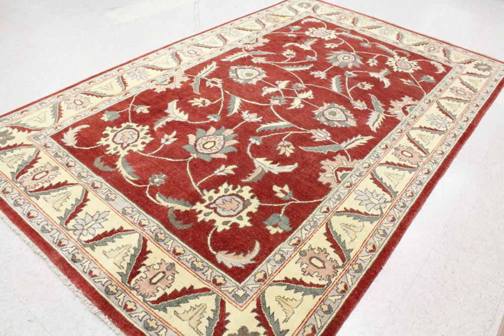 Appraisal: HAND KNOTTED ORIENTAL CARPET Pakistani Persian traditional scrolling floral raceme