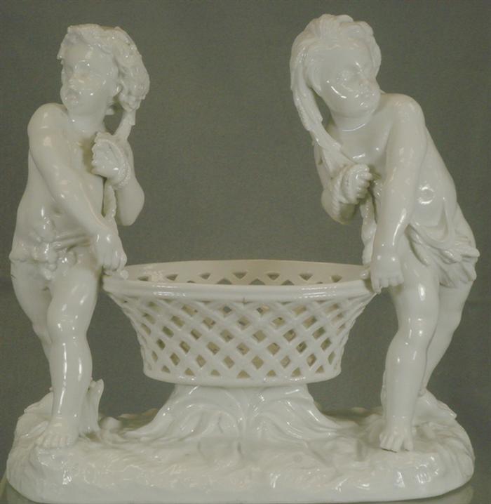 Appraisal: Meissen blanc de chine double figurine with cherubs holding a