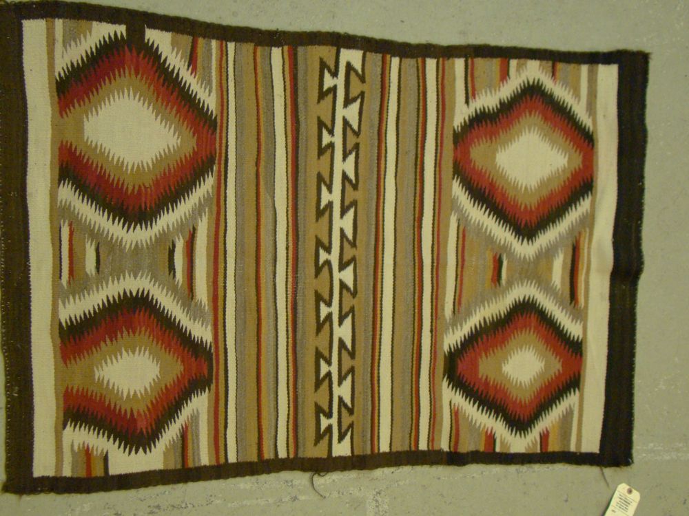 Appraisal: NAVAJO GANADO-STYLE SADDLE BLANKET ' x ' With double medallion