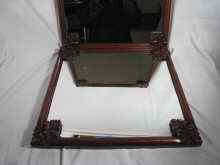 Appraisal: A pair of mahogany framed mirrors with carved corners approx