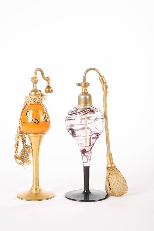 Appraisal: TWO PERFUME ATOMIZERS One orange with black and gold floral