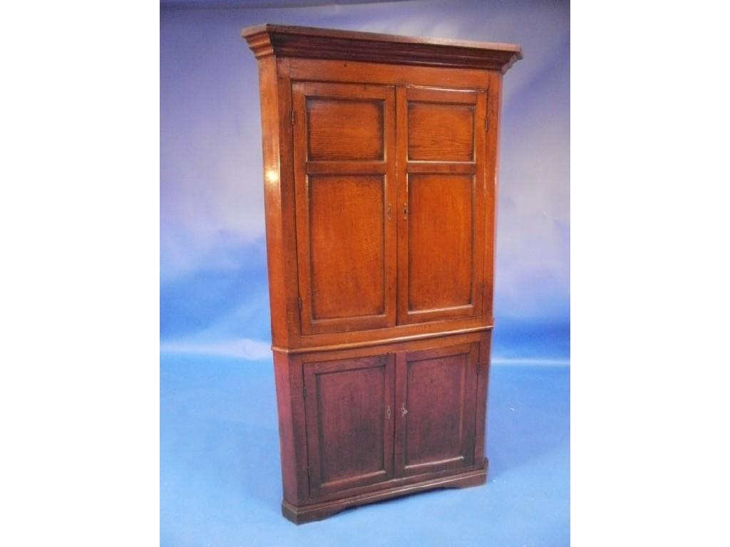 Appraisal: A thC oak standing corner cupboard with a moulded frieze