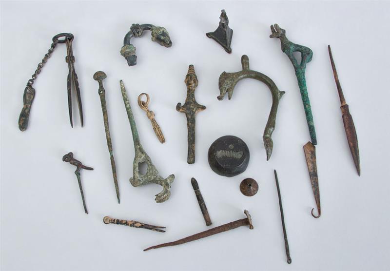 Appraisal: MISCELLANEOUS GROUP OF ANCIENT BRONZE FIBULAE AND METAL FRAGMENTS Largest