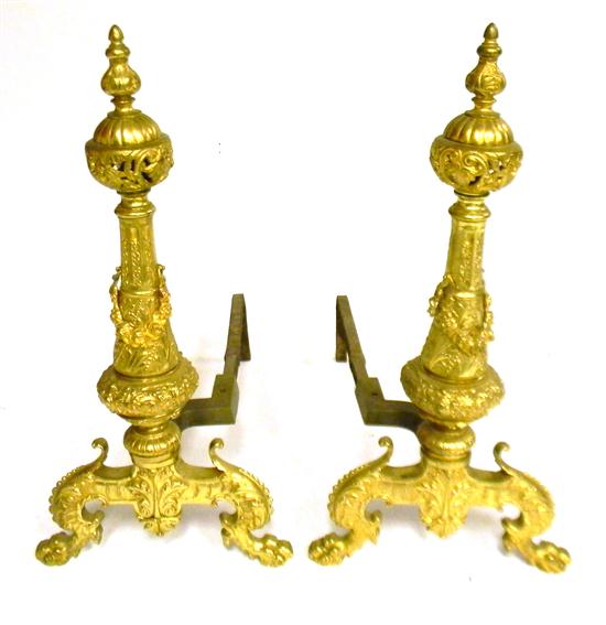 Appraisal: Pair of ornate brass andirons pierced ball finial atop ornately