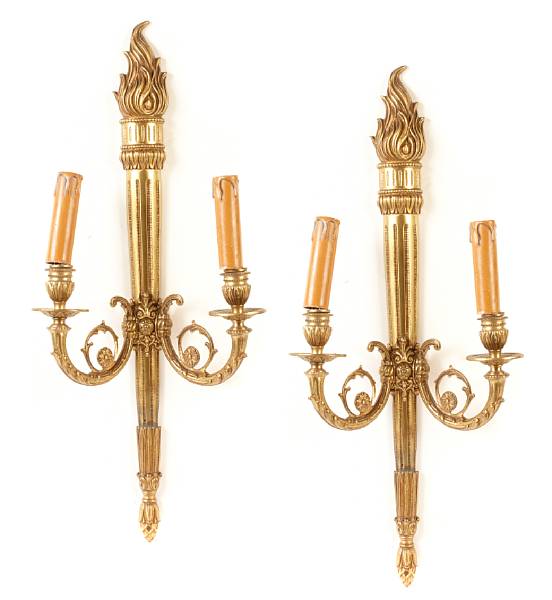 Appraisal: A pair of Neoclassical style gilt metal two light sconces