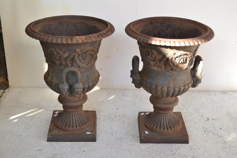 Appraisal: A PAIR OF CLASSICAL STYLE CAST IRON URNS A PAIR