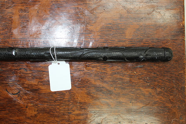 Appraisal: AN IRISH BOG OAK WALKING CANE with carved clover leaf