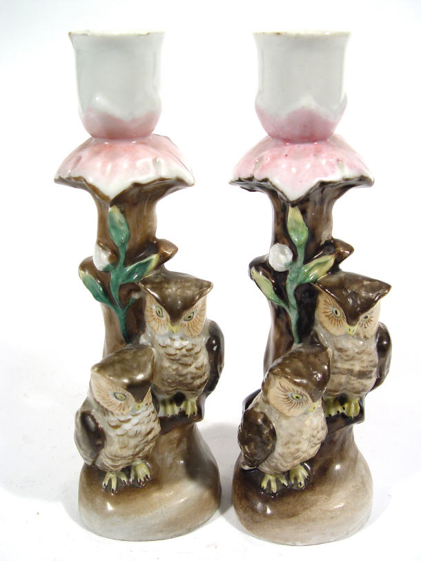 Appraisal: Pair of hand painted Continental porcelain owl design candlesticks each