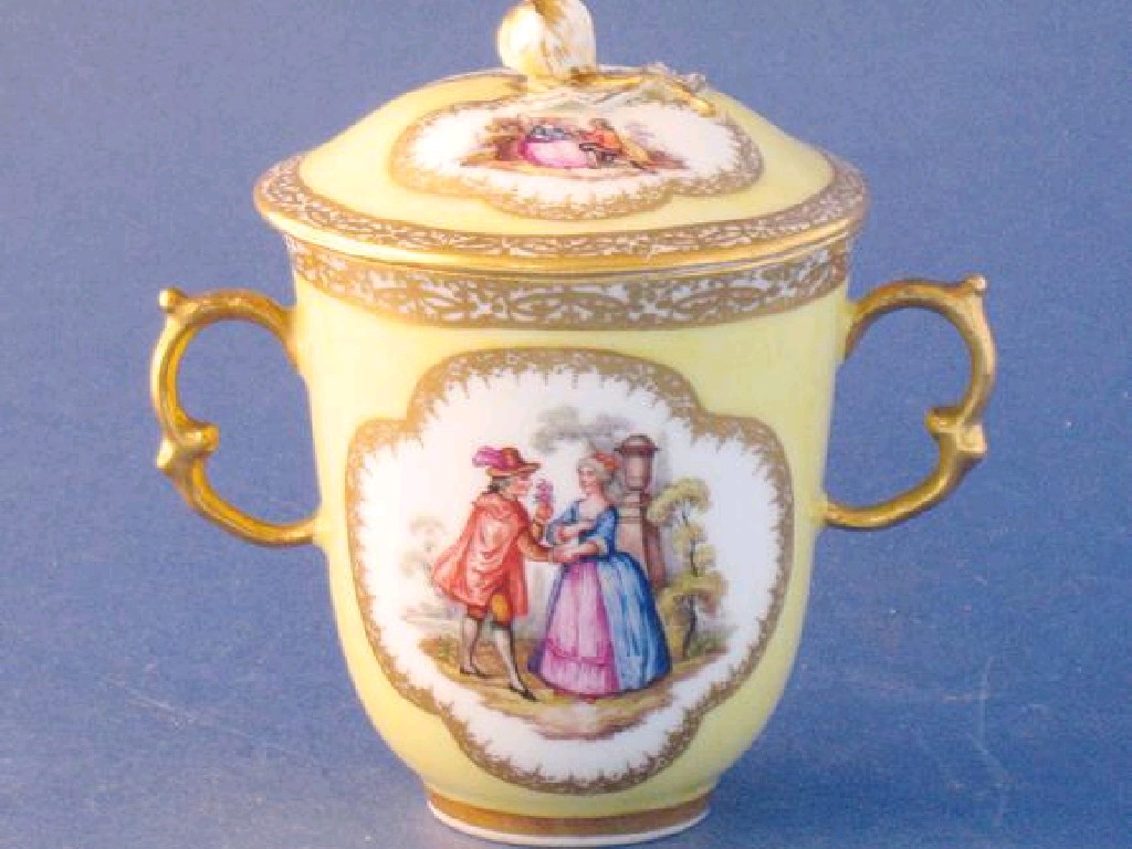 Appraisal: A DRESDEN YELLOW GROUND CHOCOLATE CUP AND COVER with twin