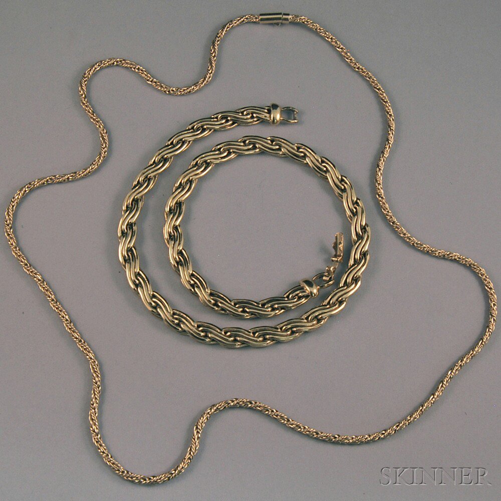 Appraisal: Two Heavy Gold and Gold-tone Chains a long kt gold