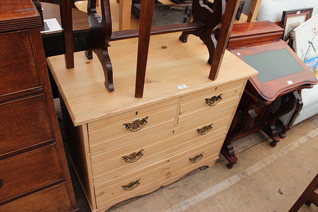 Appraisal: AN EDWARDIAN WAXED PINE CHEST of two short and two