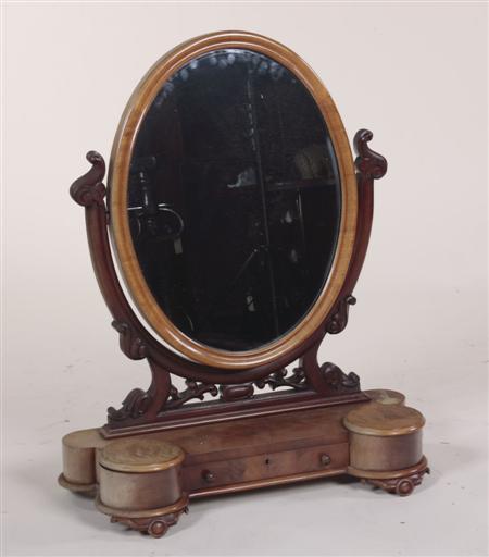 Appraisal: A Victorian mahogany oval dressing mirror the moulded frame raised