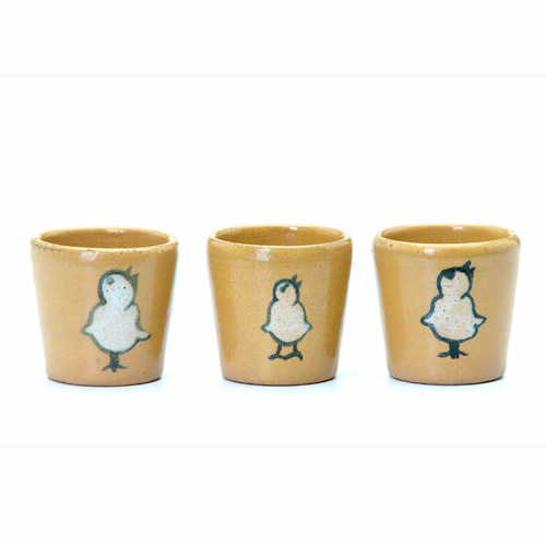 Appraisal: SATURDAY EVENING GIRLS Three egg cups each painted with a