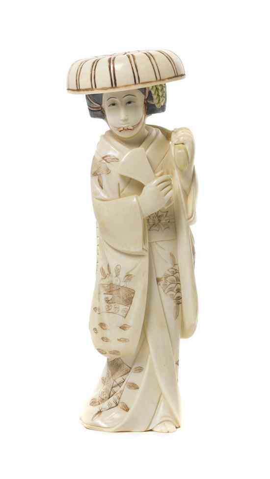 Appraisal: A Japanese Carved Ivory Okimono of a Lady polychrome decorated