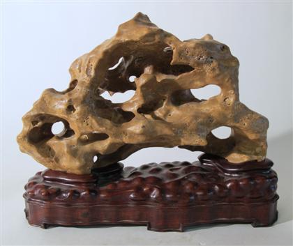 Appraisal: Large Chinese scholars rock on standYellow brown hue openwork on