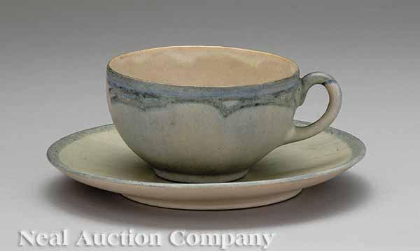 Appraisal: A Newcomb College Art Pottery Satin Glaze Teacup and Saucer