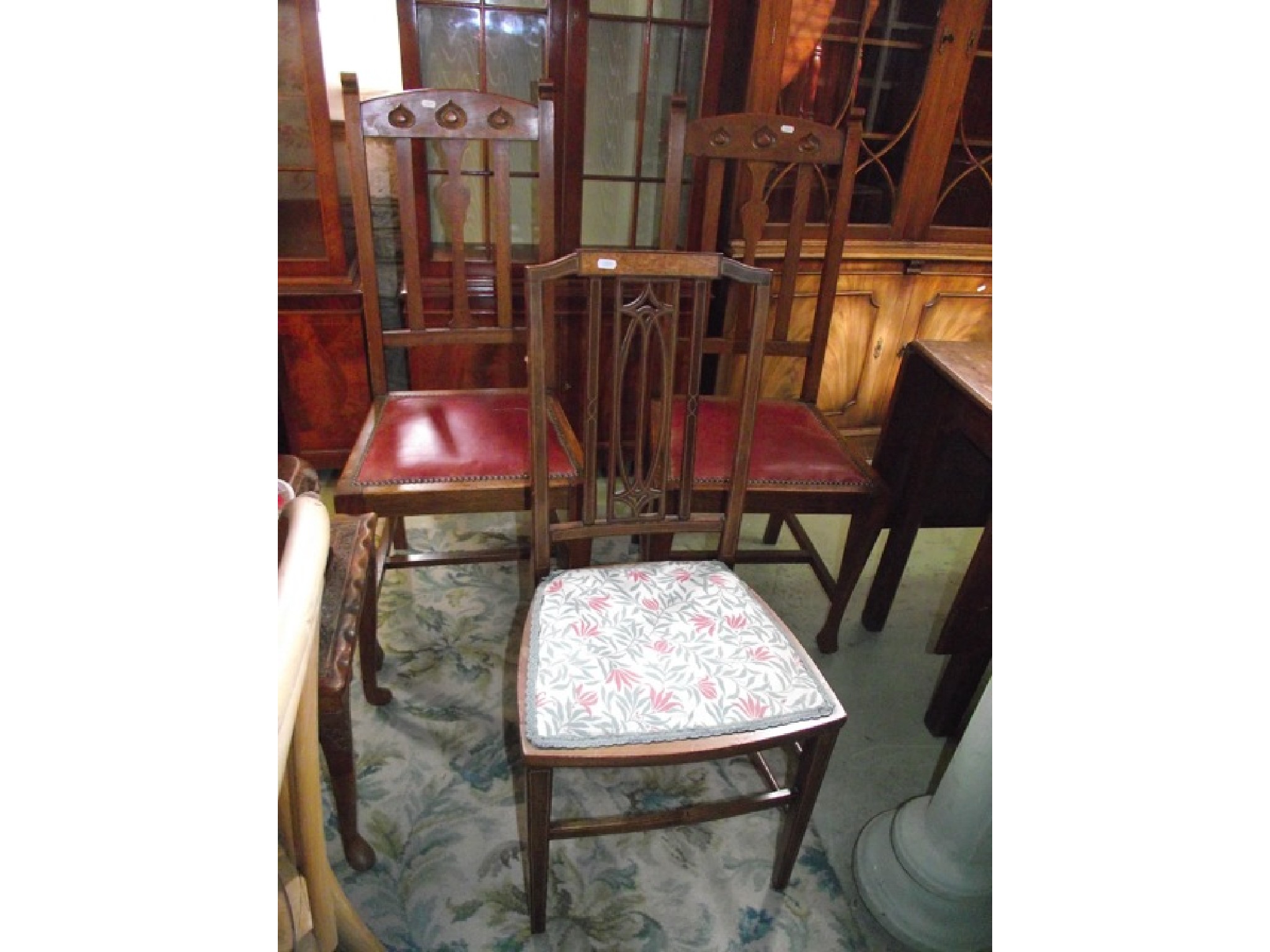 Appraisal: A pair of arts and crafts style oak dining chairs