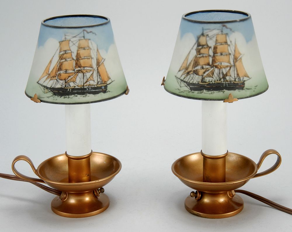 Appraisal: PAIR OF PAIRPOINT COPPER CHAMBERSTICK LAMPS Reverse-painted shades with whale