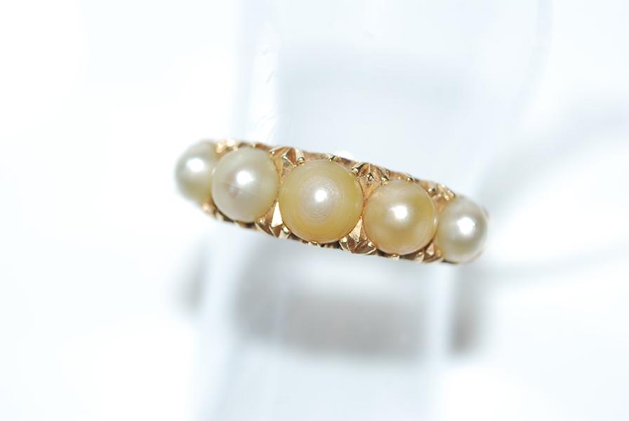 Appraisal: A CULTURED PEARL HALF HOOP RING BY W DRUMMOND AND