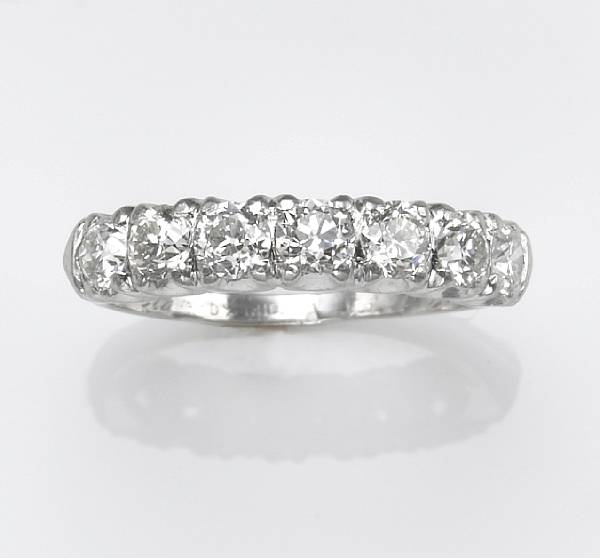 Appraisal: A diamond and platinum wedding band estimated total diamond weight