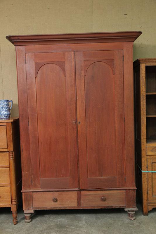 Appraisal: DOUBLE DOOR WARDROBE The wardrobe has turned feet arched panel