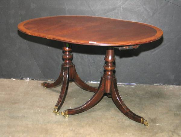 Appraisal: A Regency style mahogany double pedistal dining table mid th