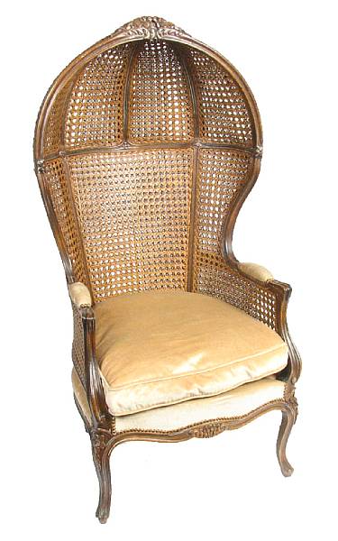 Appraisal: A Louis XV style mixed wood and cane paneled armchair