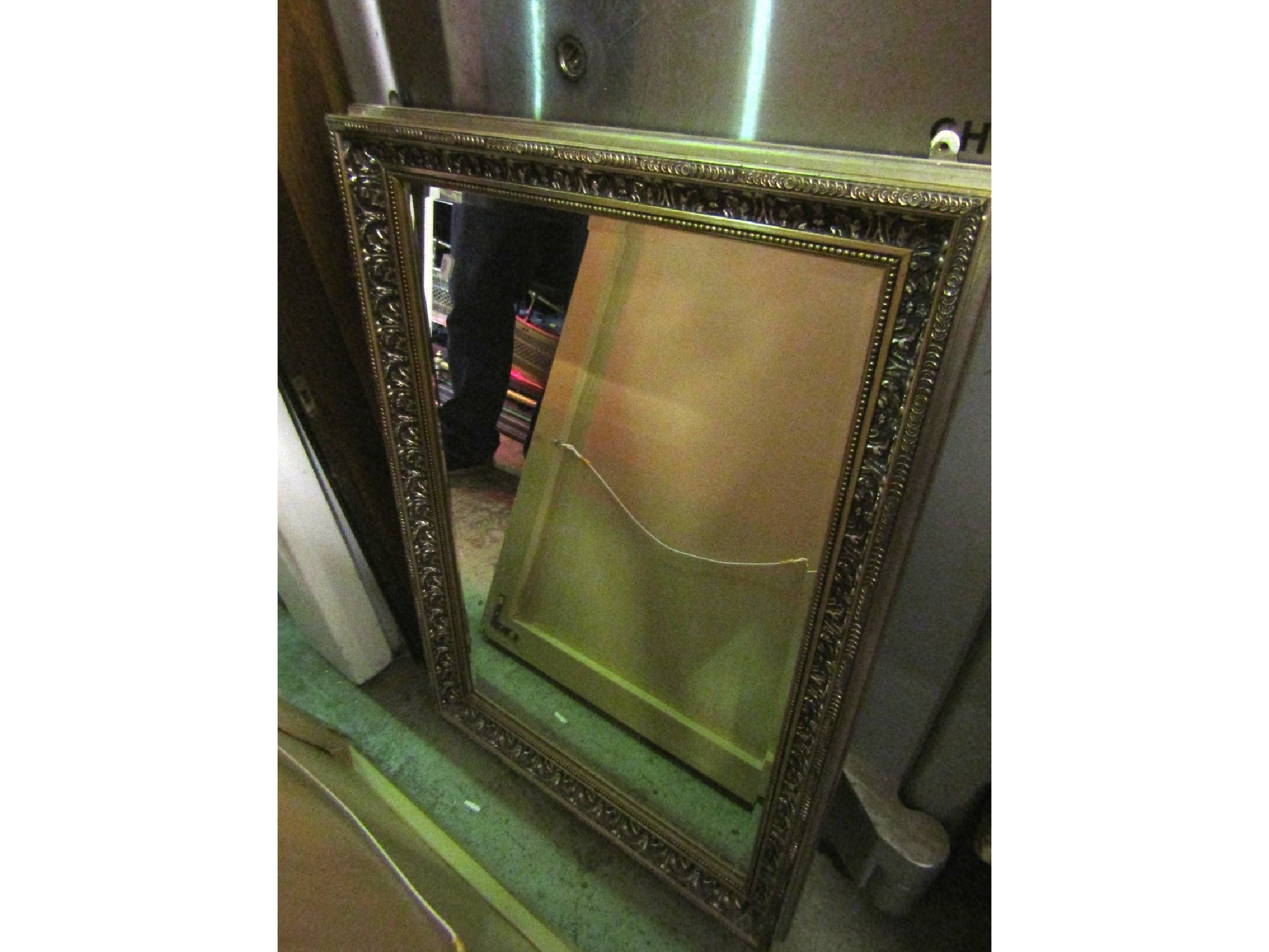 Appraisal: A contemporary gilt framed wall mirror of rectangular form with