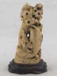 Appraisal: A well carved Oriental ivory group of fisher men and