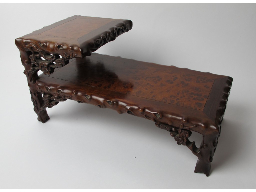 Appraisal: A Chinese burr walnut and gnarled two tier stand cm