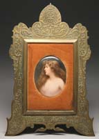 Appraisal: FRAMED OVAL HAND PAINTED PORCELAIN PLAQUE Half-portrait of a nude