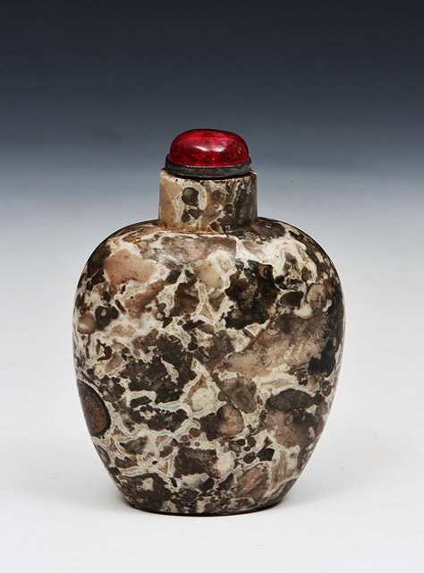 Appraisal: A CHINESE AMYLOIDAL OVIFORM SNUFF BOTTLE in mottled black and