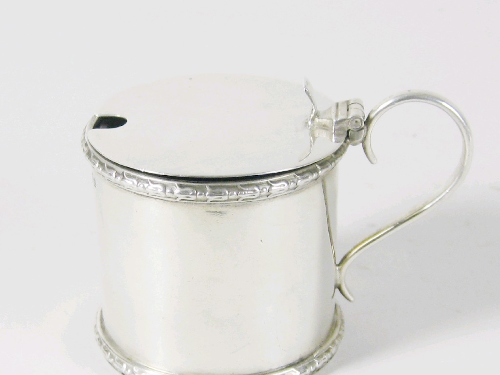 Appraisal: A George V cylindrical Mustard Pot with hinged cover Chester